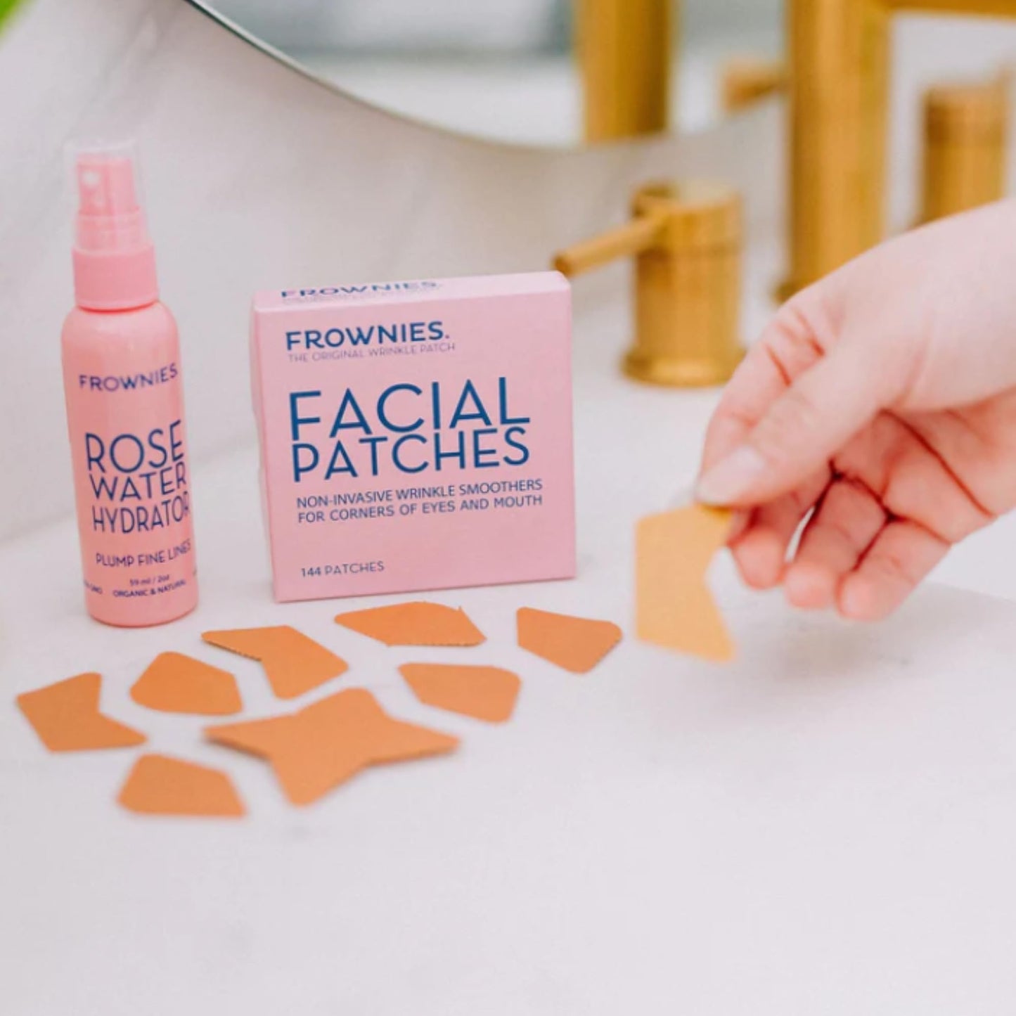 Frownies hypoallergenic face tape for smile lines and marionette lines highlighting the full one hundred forty four count box.