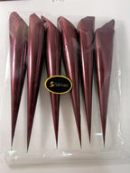 Large empty crafting cones arranged for mehndi and cake icing