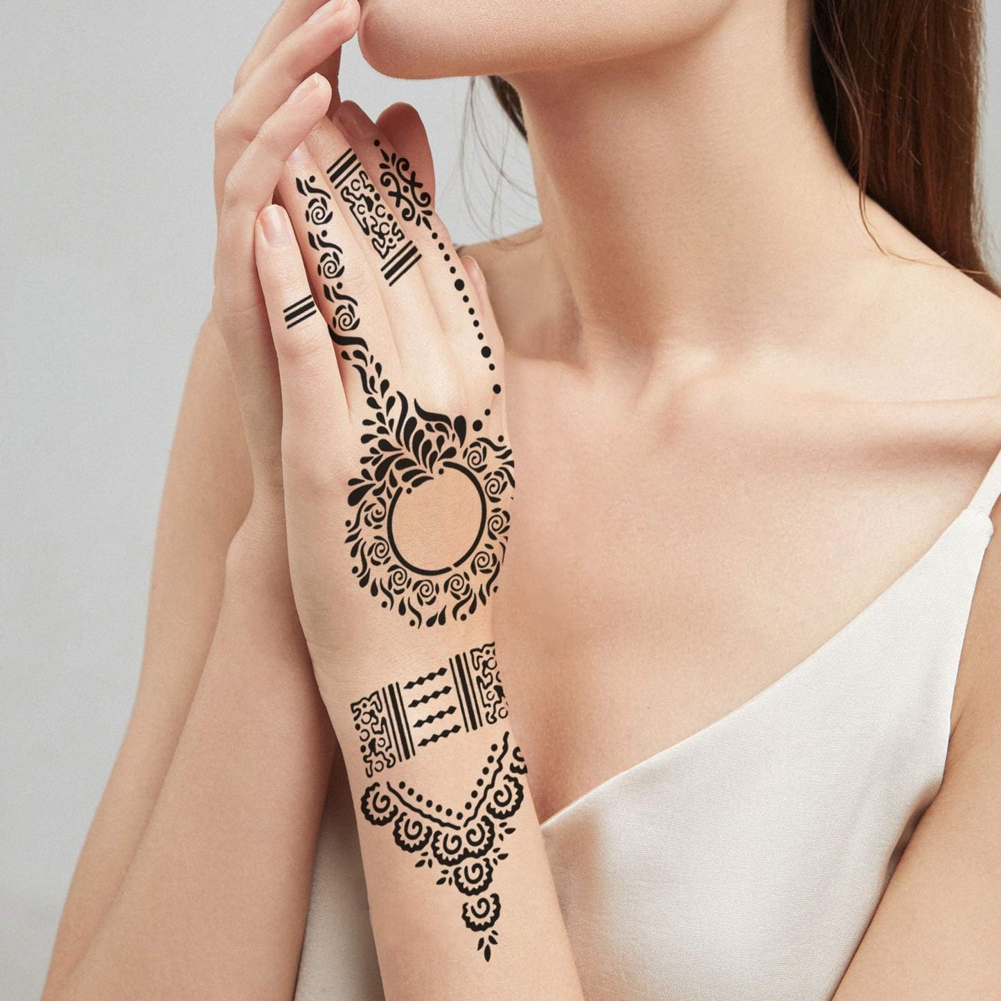 Demonstration of the washable and non toxic PVC material of the temporary body art stencils.