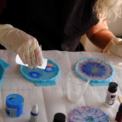 Ruibow craft dispenser kit being utilized for precise liquid glue application on a delicate DIY project.