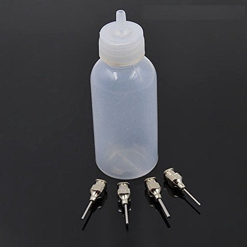 Clear thirty milliliter squeeze bottle showing four different sizes of interchangeable metal nozzle tips.