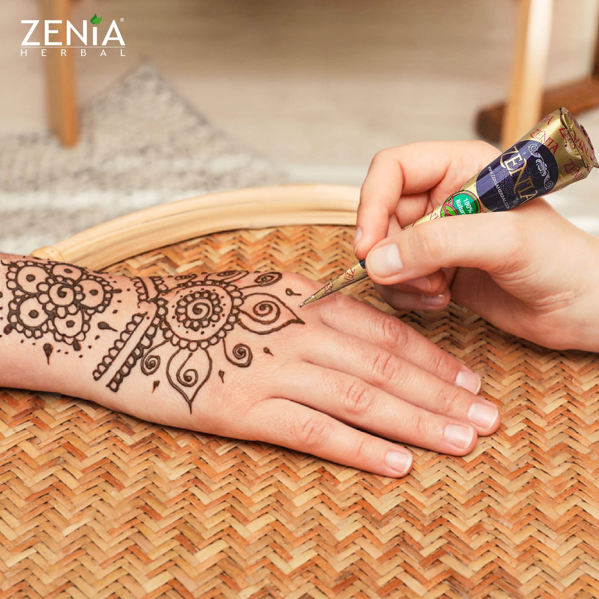Person applying Zenia henna paste for temporary freckles