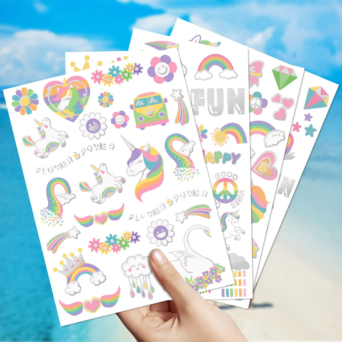 Children applying unicorn rainbow temporary tattoo stickers
