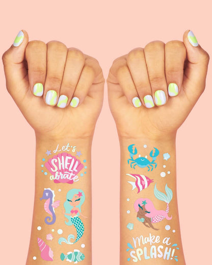Kids enjoying mermaid themed temporary tattoos at a birthday party