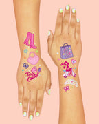 Variety of Xo, Fetti pink party supplies and temporary tattoo sheets