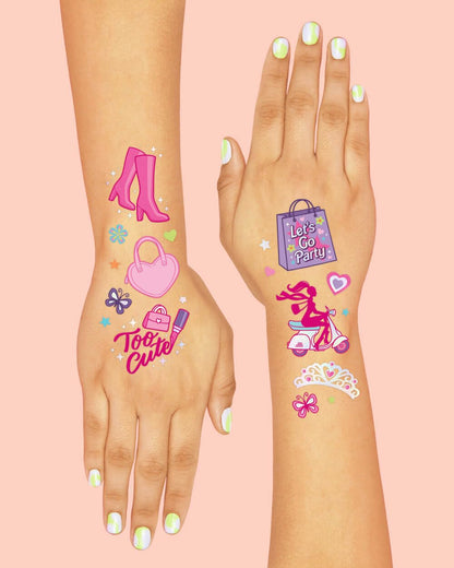 Variety of Xo, Fetti pink party supplies and temporary tattoo sheets