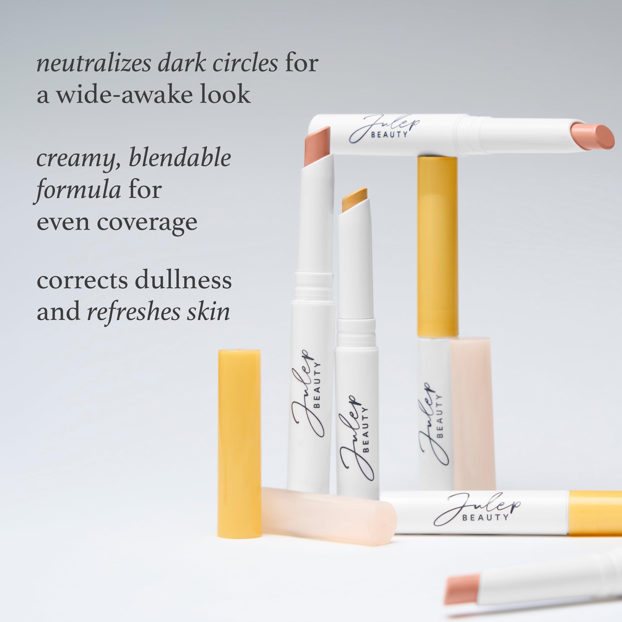 Applying Julep under eye corrector stick on skin