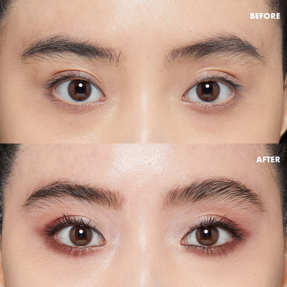 Model applying Nyx Control Freak Gel to eyebrows