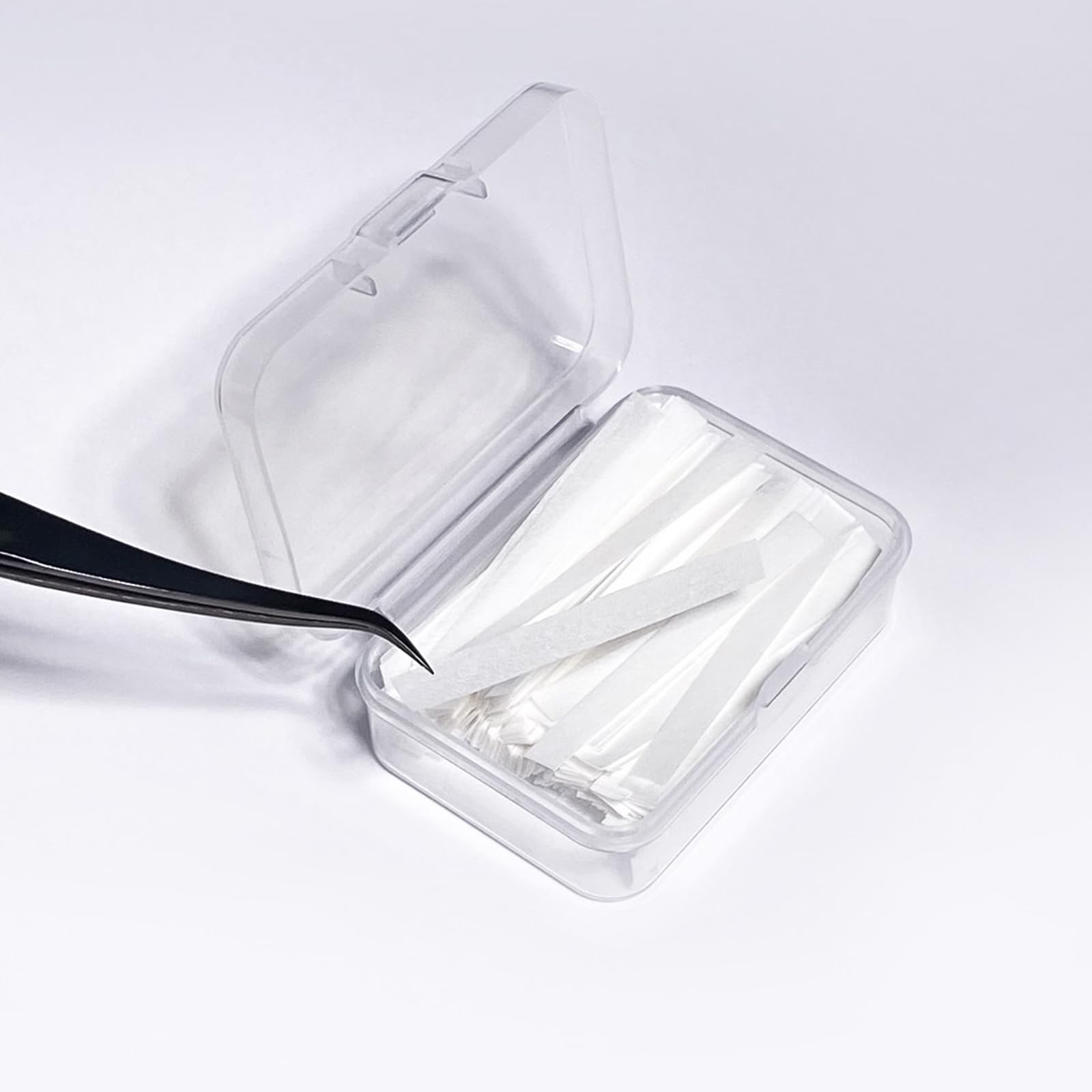 Authentic USA imported PERMANIA lash lift paper strips highlighting the texture designed to prevent hair slippage.