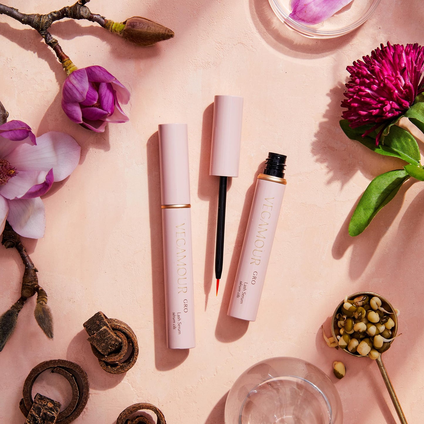 VEGAMOUR eyelash growth support serum unboxed showing the sleek metallic applicator tube.