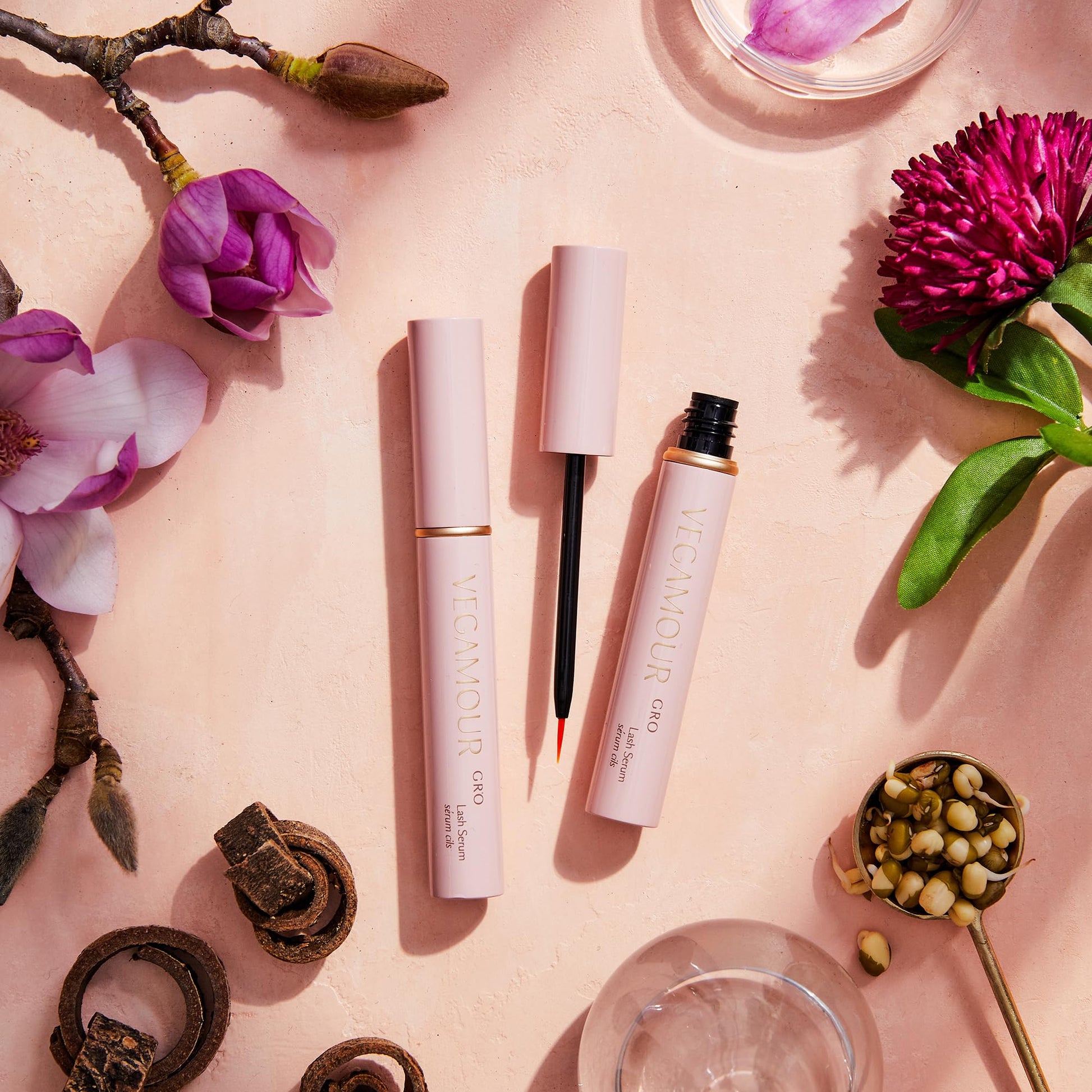 VEGAMOUR eyelash growth support serum unboxed showing the sleek metallic applicator tube.