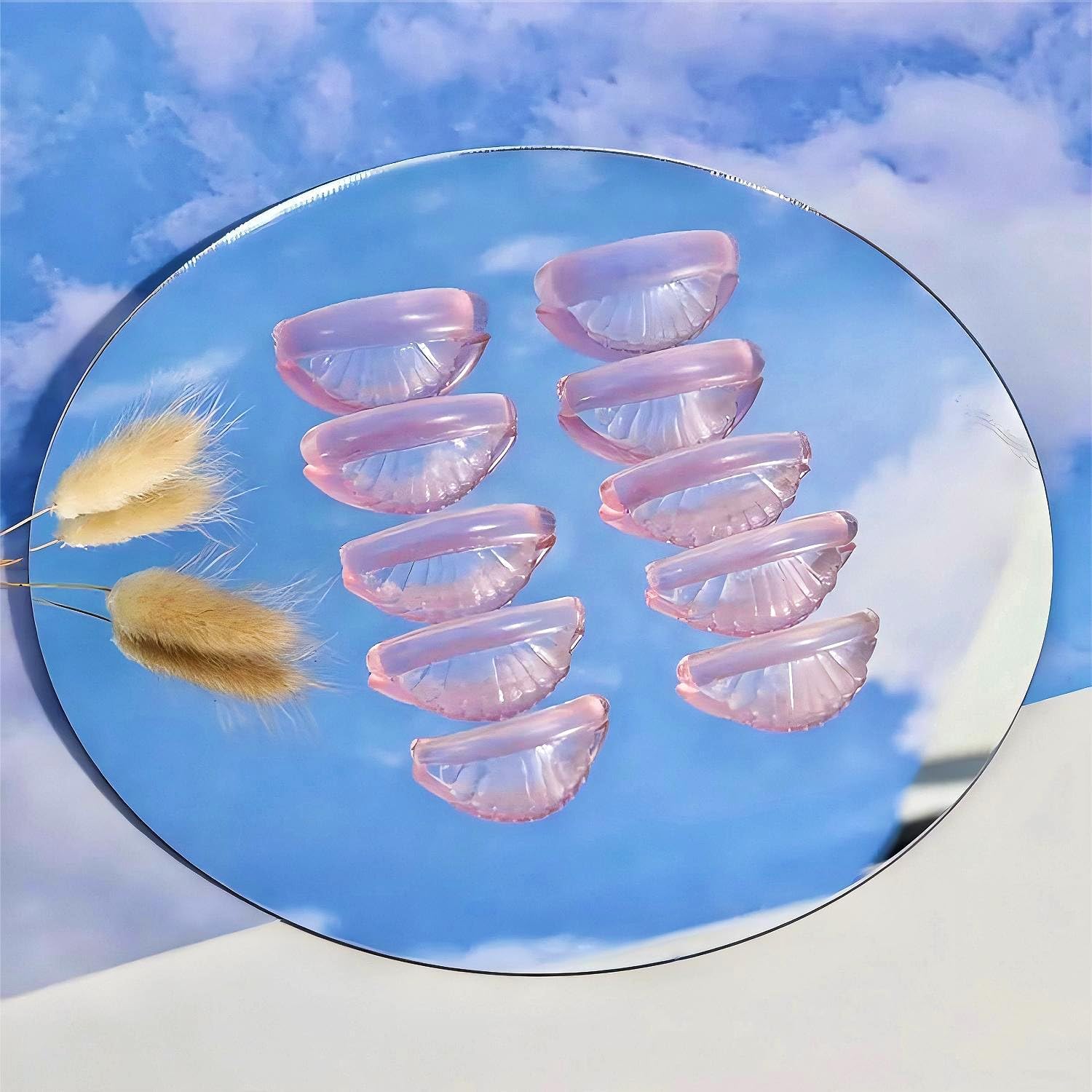 Liber Beauty eyelash perming rollers laid out showing the smooth self adhesive eyelid backing