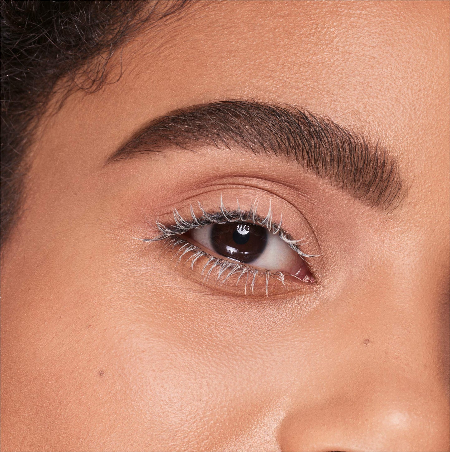 Close up view of the volumizing brush head on the COVERGIRL lash primer