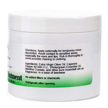 Warming herbal topical ointment container showing the back label with ingredients and usage instructions.