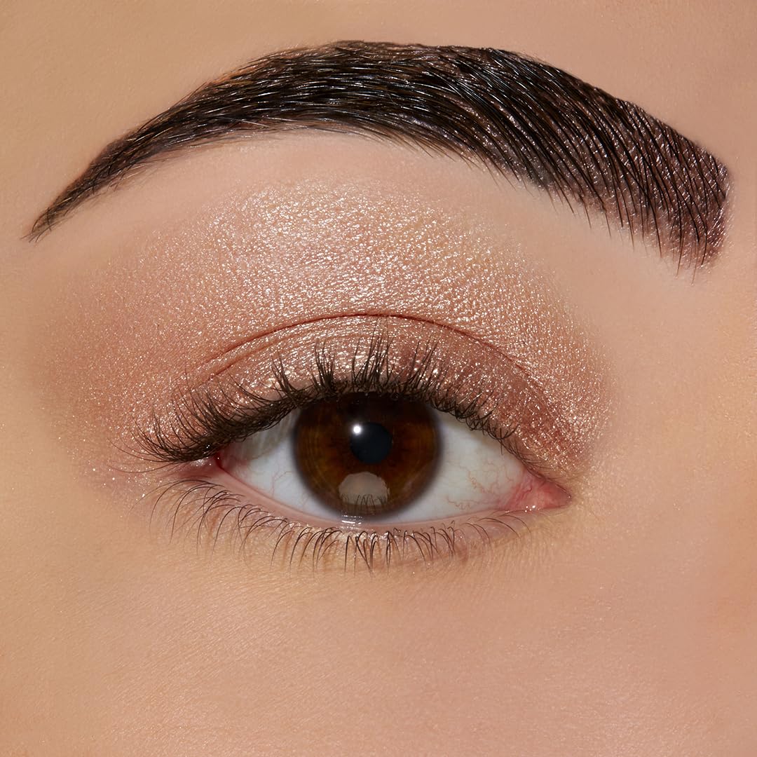 Sigma Beauty eyeshadow base primer swatch on skin illustrating pinky-peach payoff