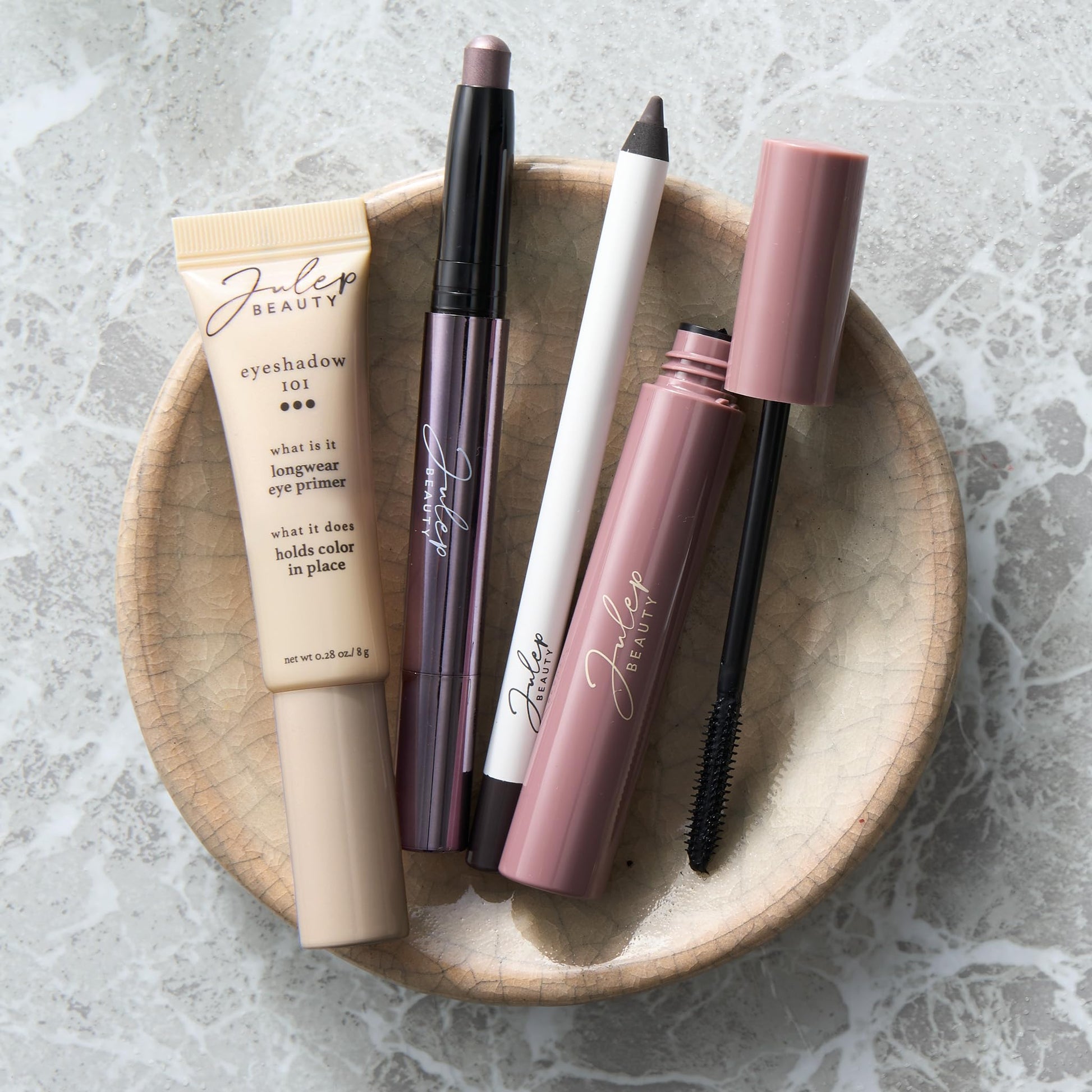 Transparent moisturizing eyeshadow primer tube standing upright