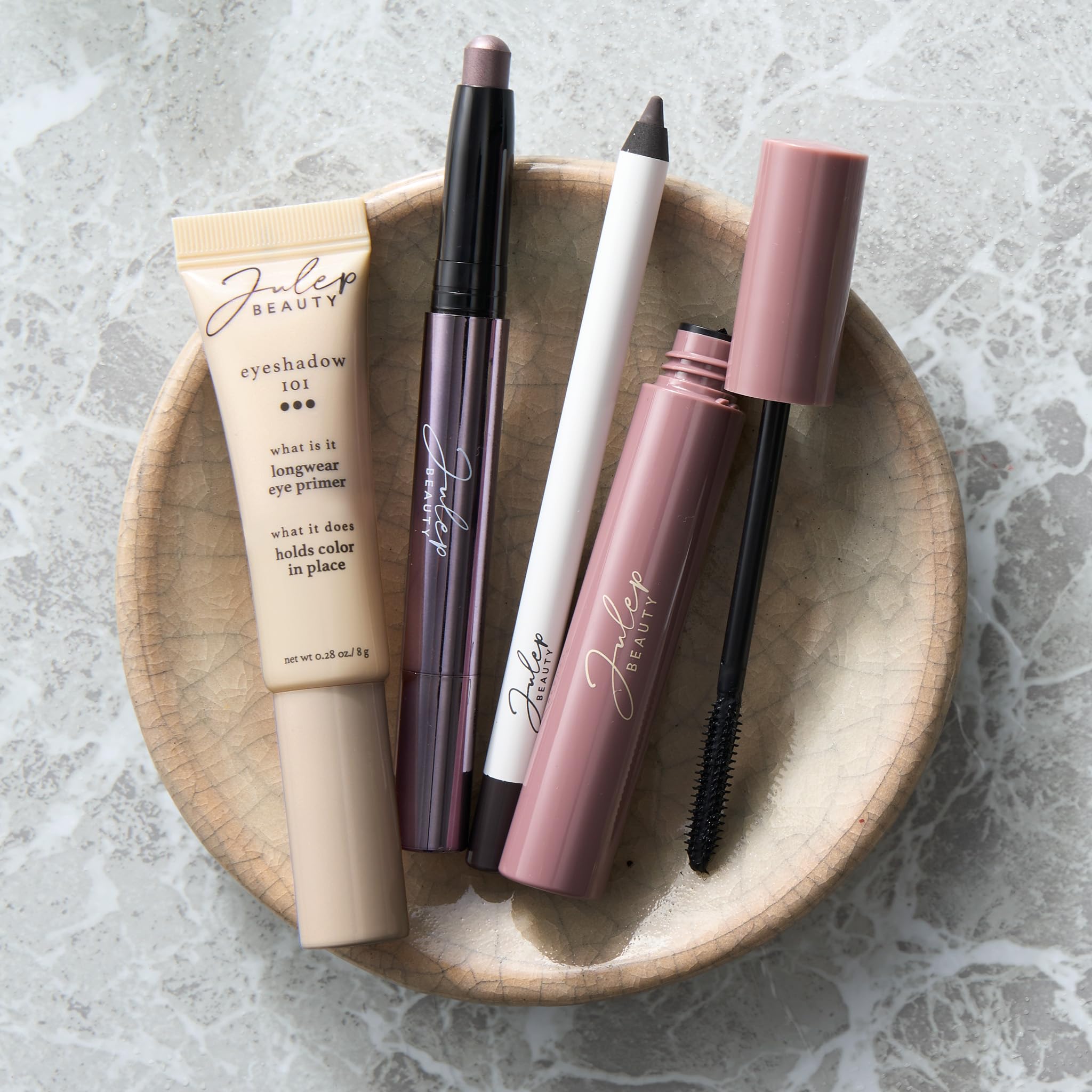 Transparent moisturizing eyeshadow primer tube standing upright