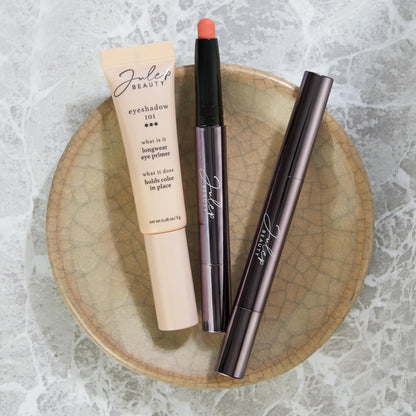 Smudge proof eyeshadow base cosmetic product close up shot