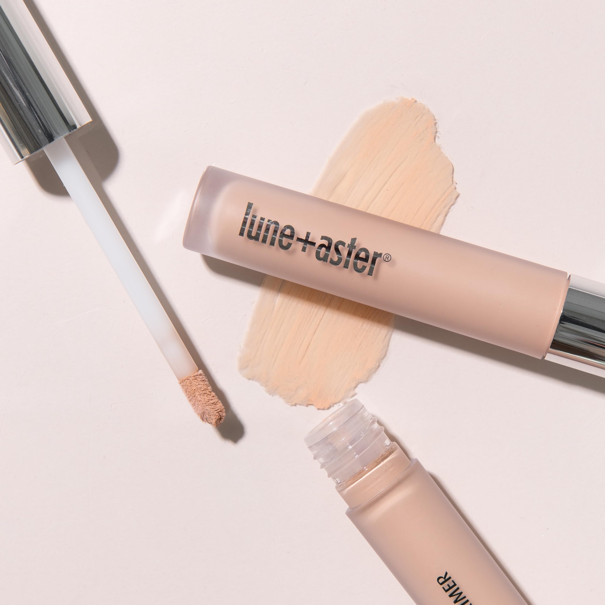 Lune+Aster brightening eye primer being applied to demonstrate its soft focus smoothing effect.