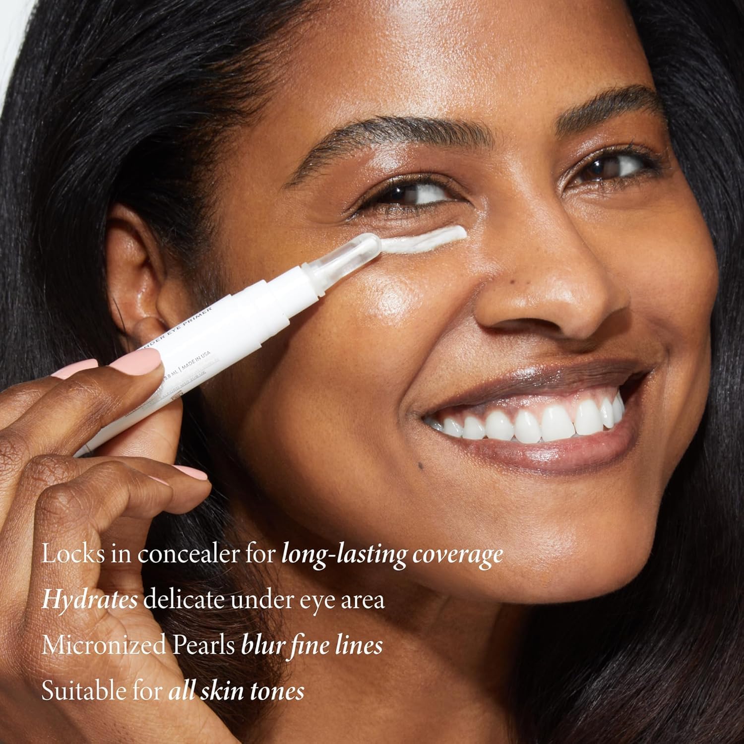 Laura Geller under eye primer wand applicator showing cream texture