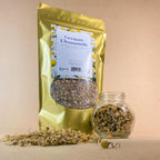 A freshly brewed cup of caffeine-free loose leaf herbal tea made from authentic bMAKER chamomile flowers.