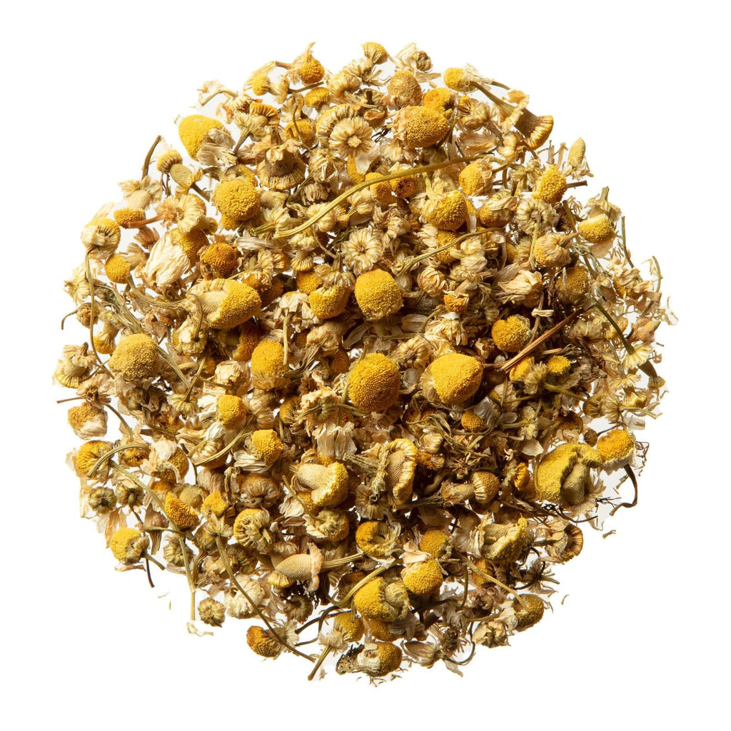 A handful of authentic unbleached German chamomile flowers sourced directly from Egypt