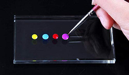 Sinen glass palette held in hand for size reference