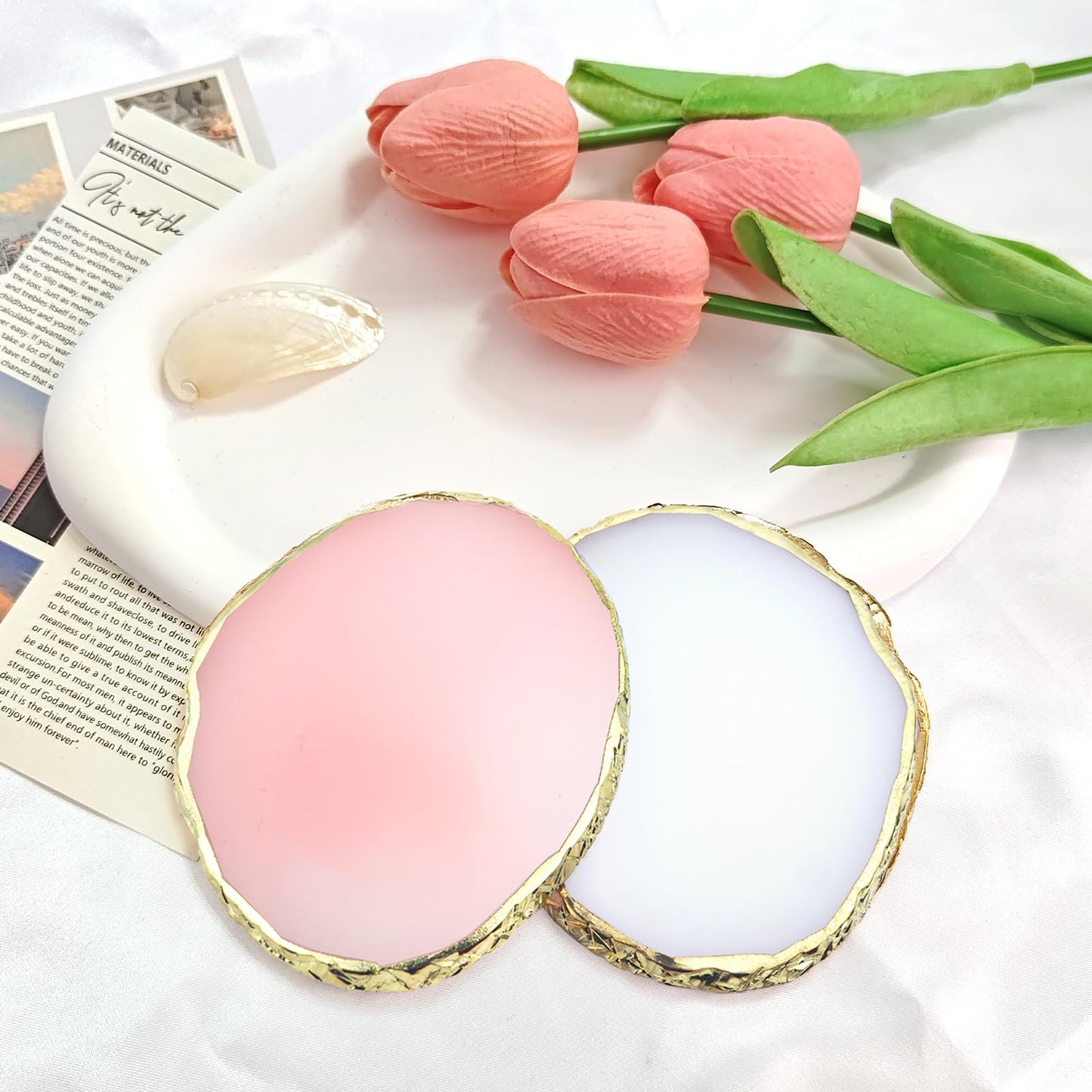 Two resin nail palettes in pink and white with gold edges