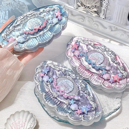 Flower Knows Shell's Jewel palette held in hand