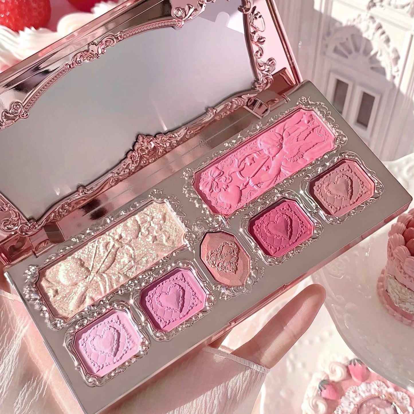 Flower Knows Strawberry Cupid palette held in hand for scale