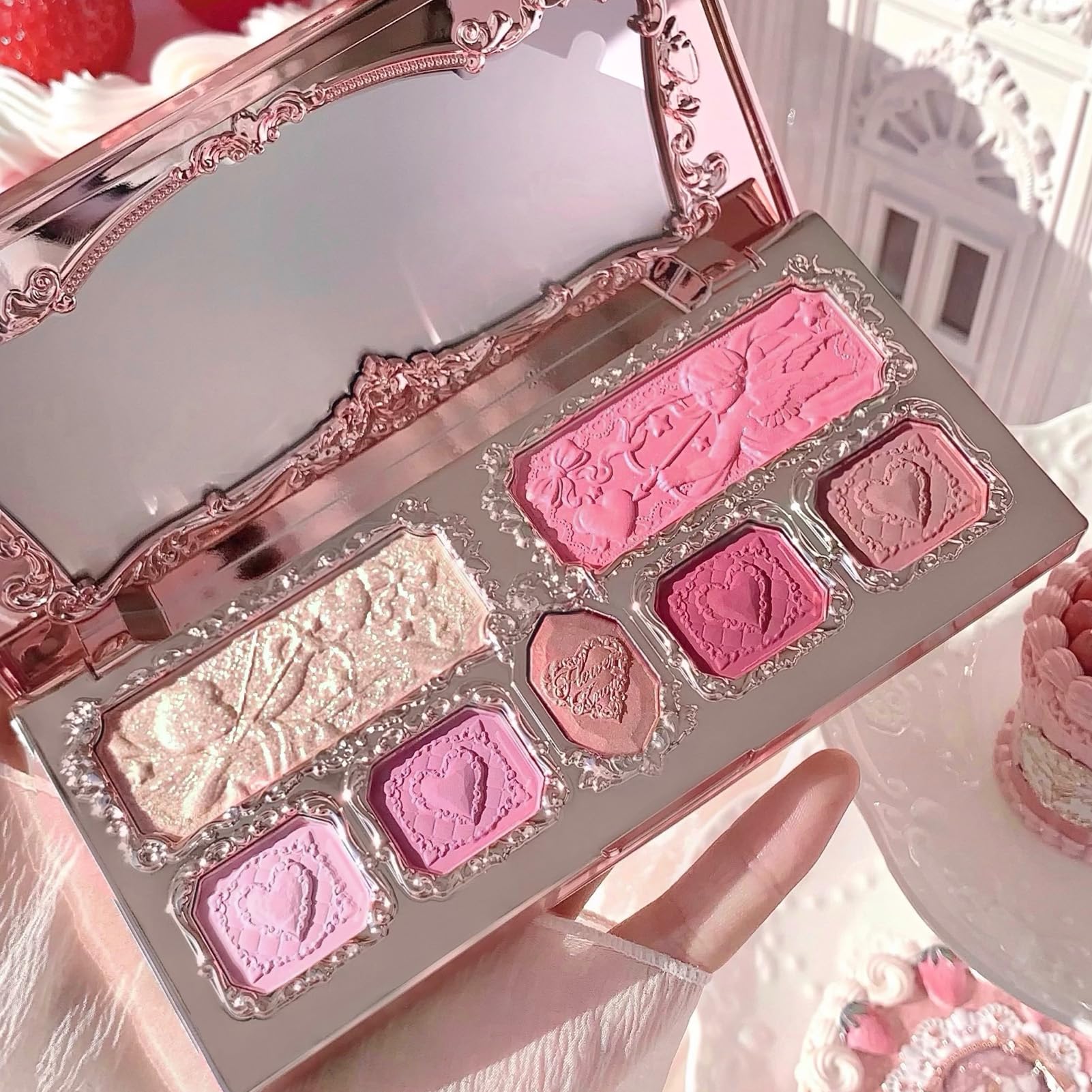 Flower Knows Strawberry Cupid palette held in hand for scale