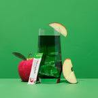 Premium green powder dietary supplement single-serve packets on a white backdrop