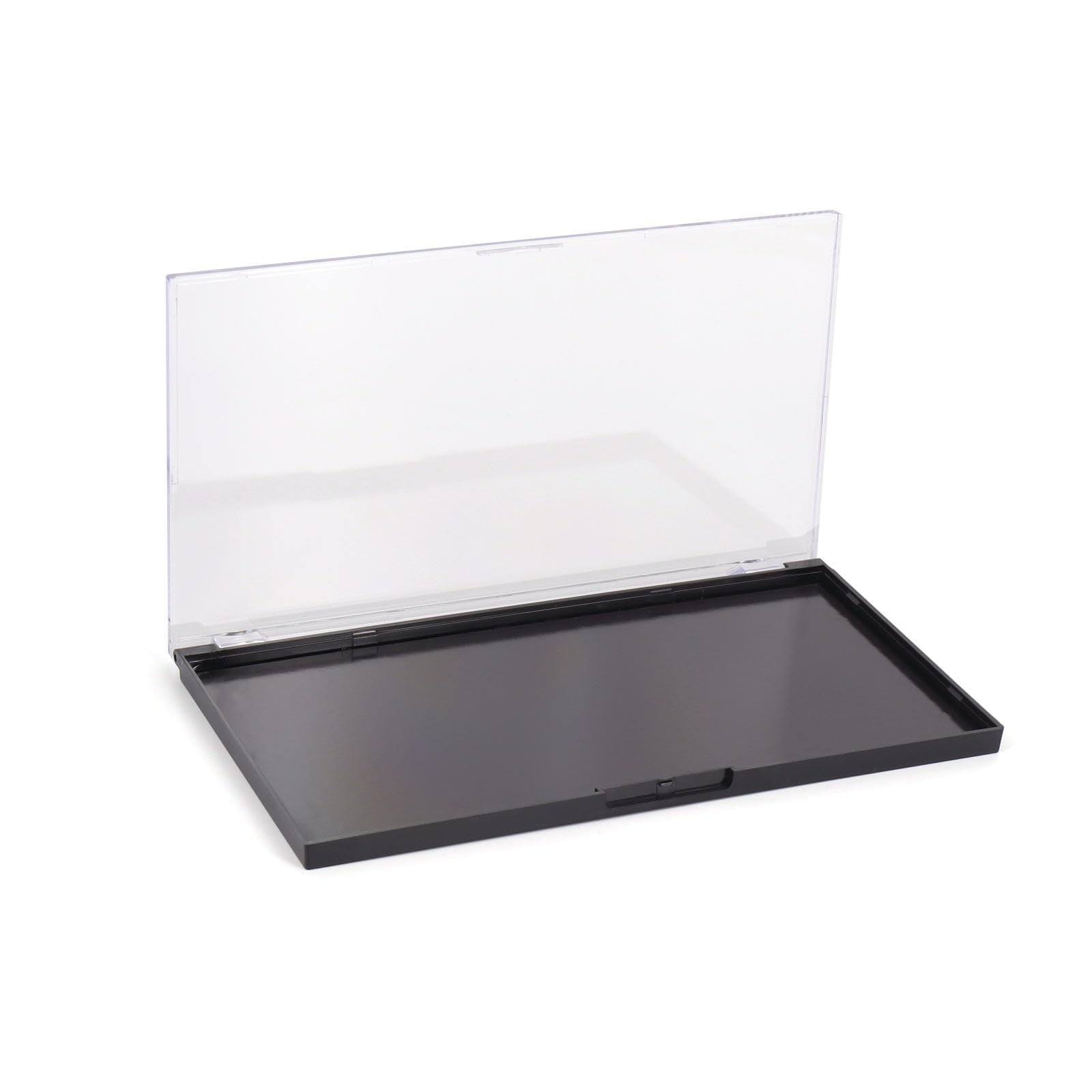 Professional makeup artist organizing cosmetics in magnetic palette