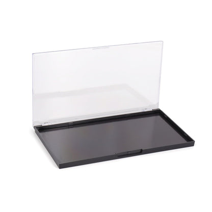 Professional makeup artist organizing cosmetics in magnetic palette