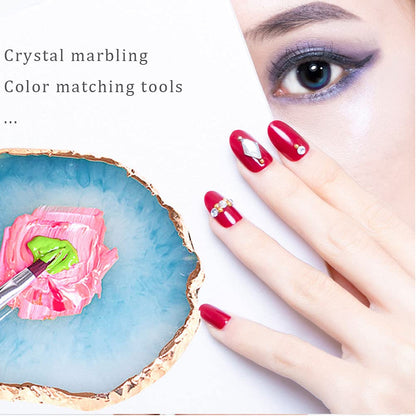 Hand holding agate style resin nail art palette for display