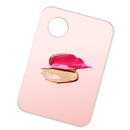 Top down view of pink and transparent mixing trays