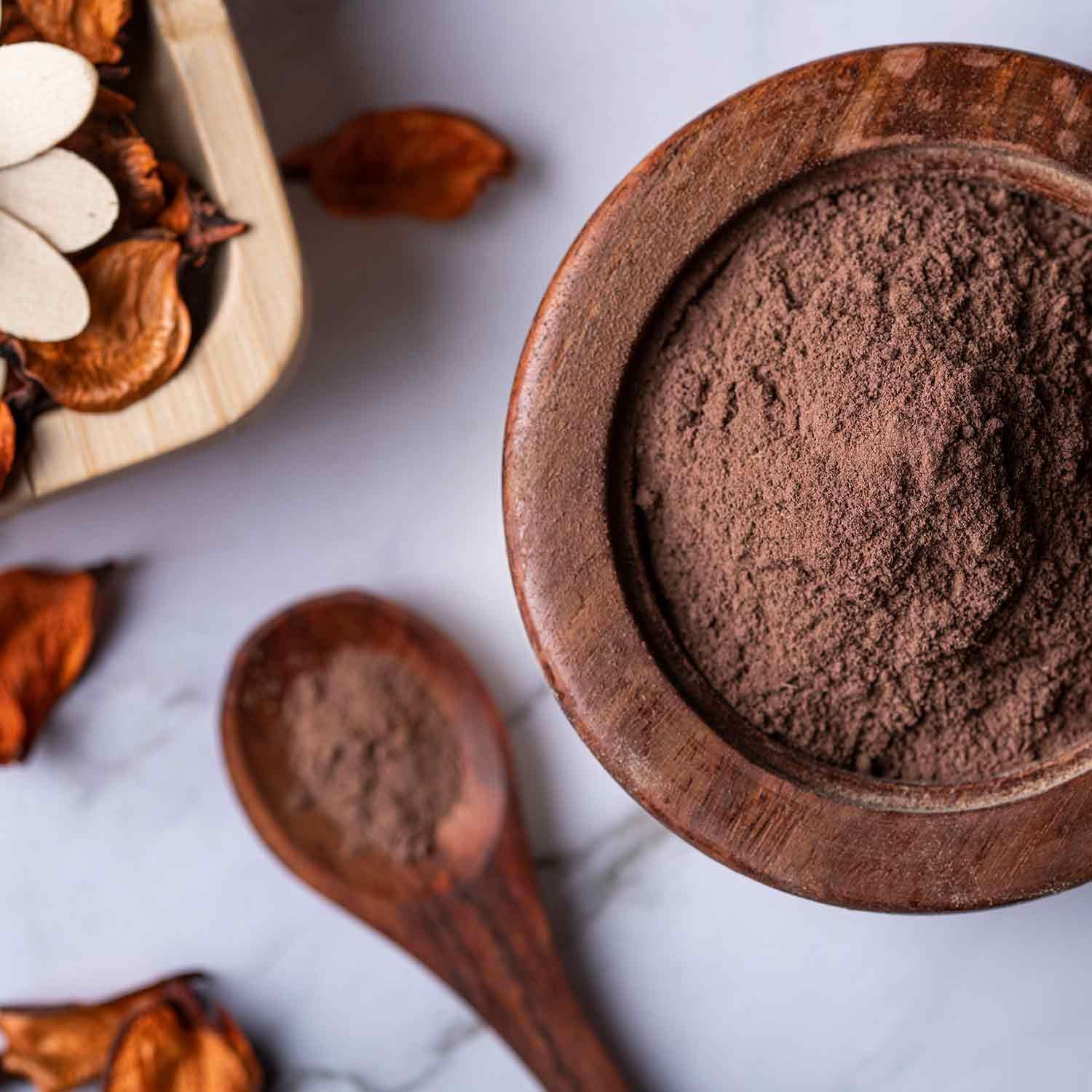Natural Ayurvedic cardiovascular support supplement being scooped for daily mixing.