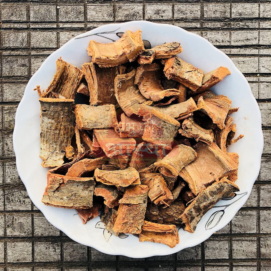 DKM Organics Arjuna Bark Powder mixed into a warm herbal milk decoction for cardiovascular support.