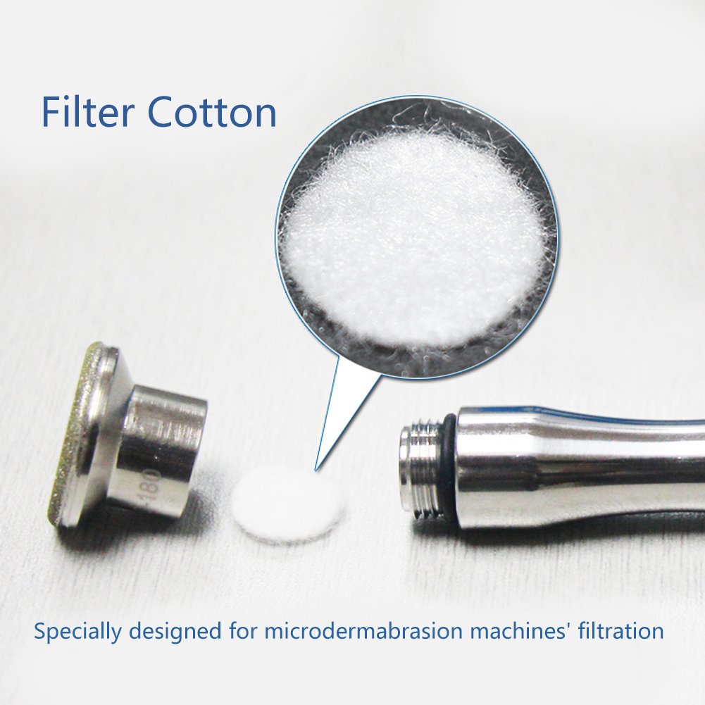 Demonstration of the eco friendly cotton filter pad being inserted into a professional diamond dermabrasion machine.