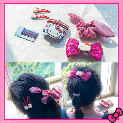 Townley Girl Hello Kitty flavored lip gloss tubes and blush compact close up view.