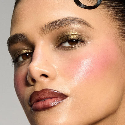 Forest green waterproof liquid eyeshadow tube with applicator open showing metallic shimmer texture