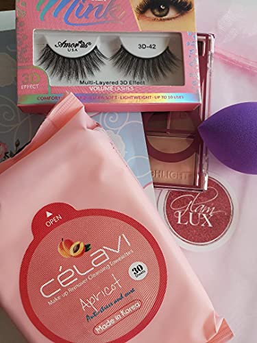 Glam Lux mystery beauty collection showcasing a random selection of liquid highlighters, lip glosses, and makeup sponges.
