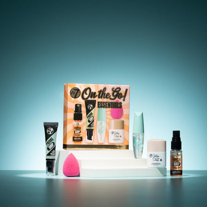 W7 Fresh Grip Setting Spray and pink mini blending beauty sponge lifestyle shot