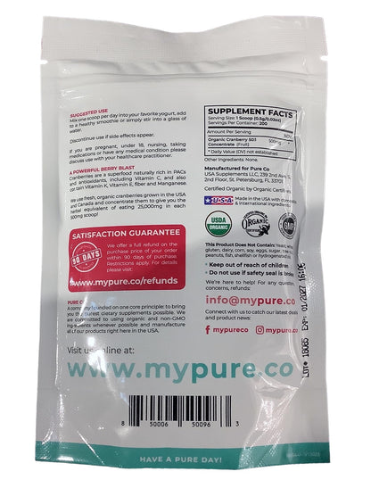 Pure Co Organic Cranberry Powder mixed in glass of water