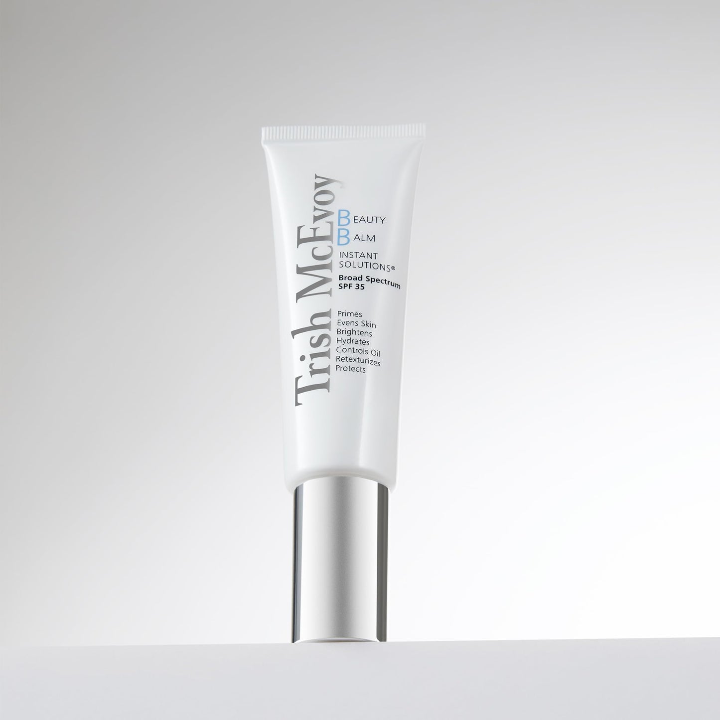 Trish McEvoy Beauty Balm Instant Solutions SPF 35 being squeezed to show the smooth creamy texture.