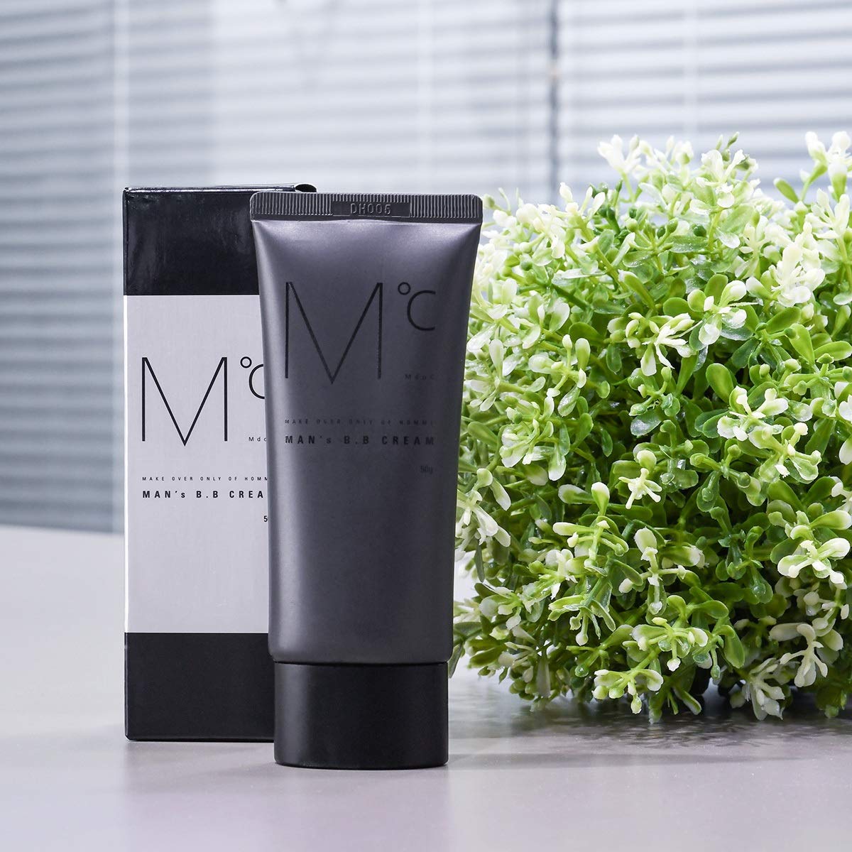 Back view of Mdoc multi-functional men's face cream with usage instructions.