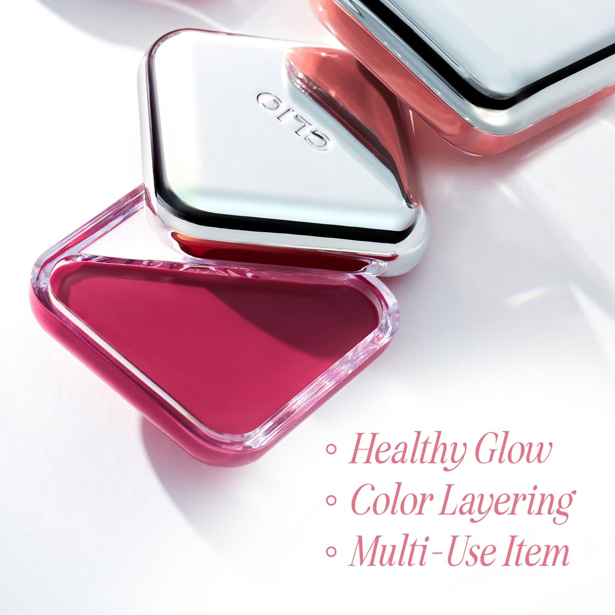 Compact travel-friendly packaging of CLIO Professional Lip and Cheek Tap next to a makeup pouch.