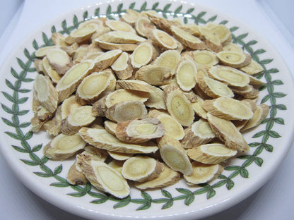 Nature Tea Astragalus membranaceus root slices close up view displaying premium traditional Chinese medicine herb quality.