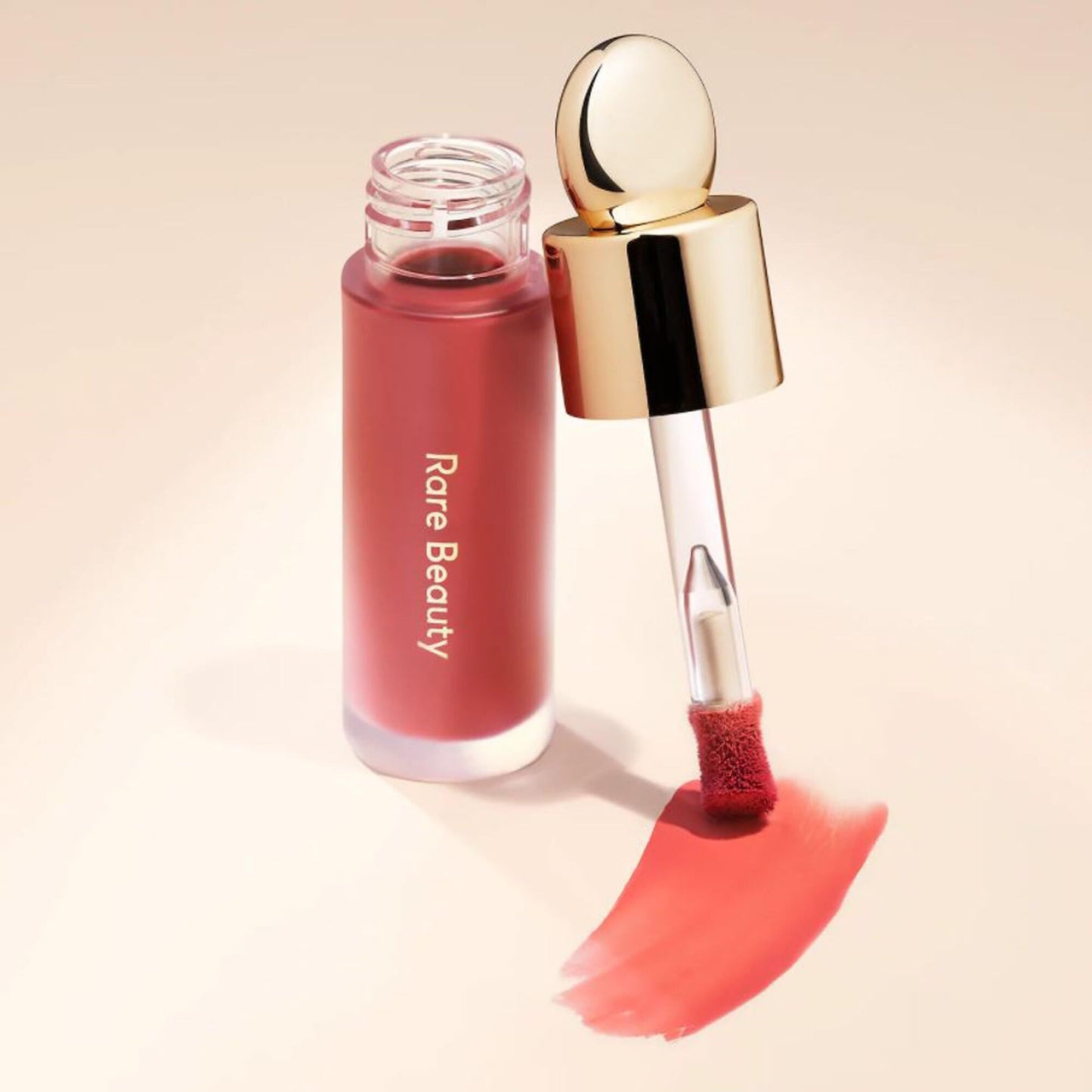 Rare Beauty Encourage shade liquid blush bottle illustrating authentic product design