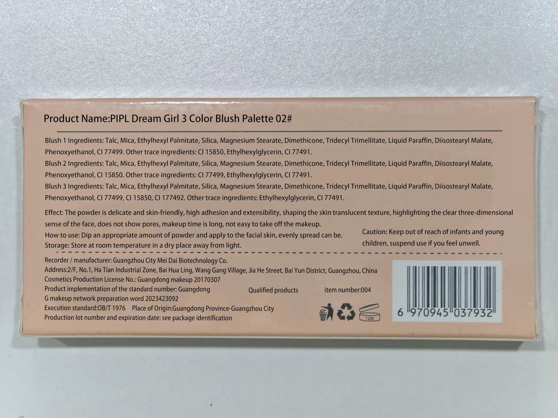 Natural matte pink powder blush product layout with soft synthetic brush